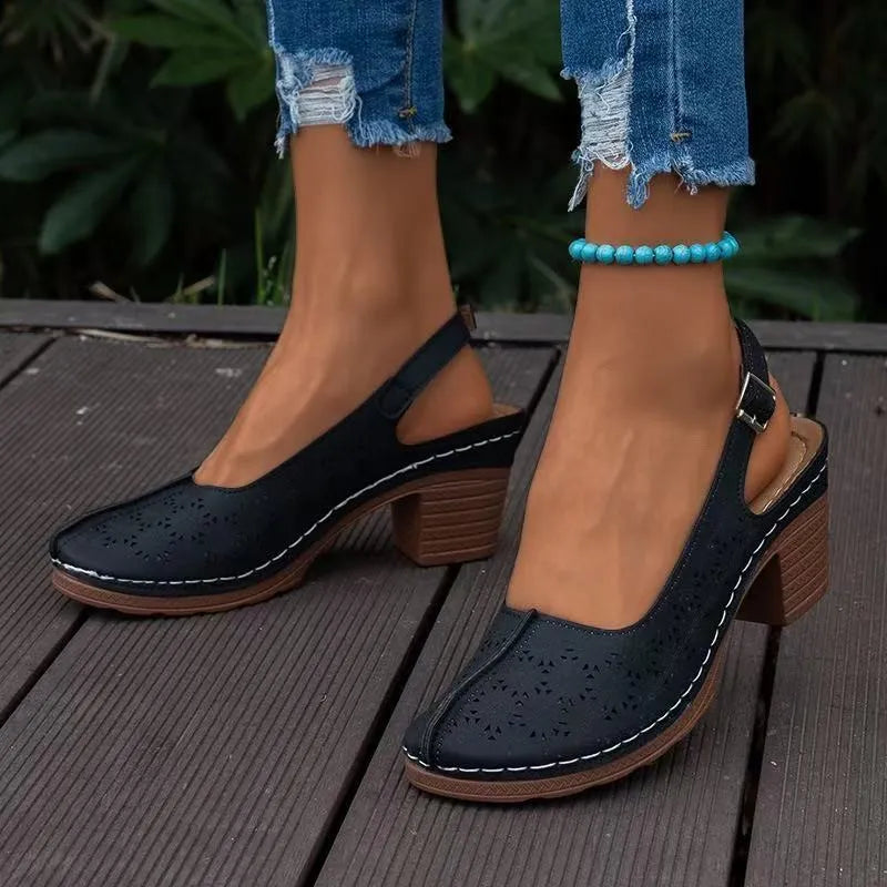 Women's black closed toe wedge sandal with a round toe and rubber sole, size 39.