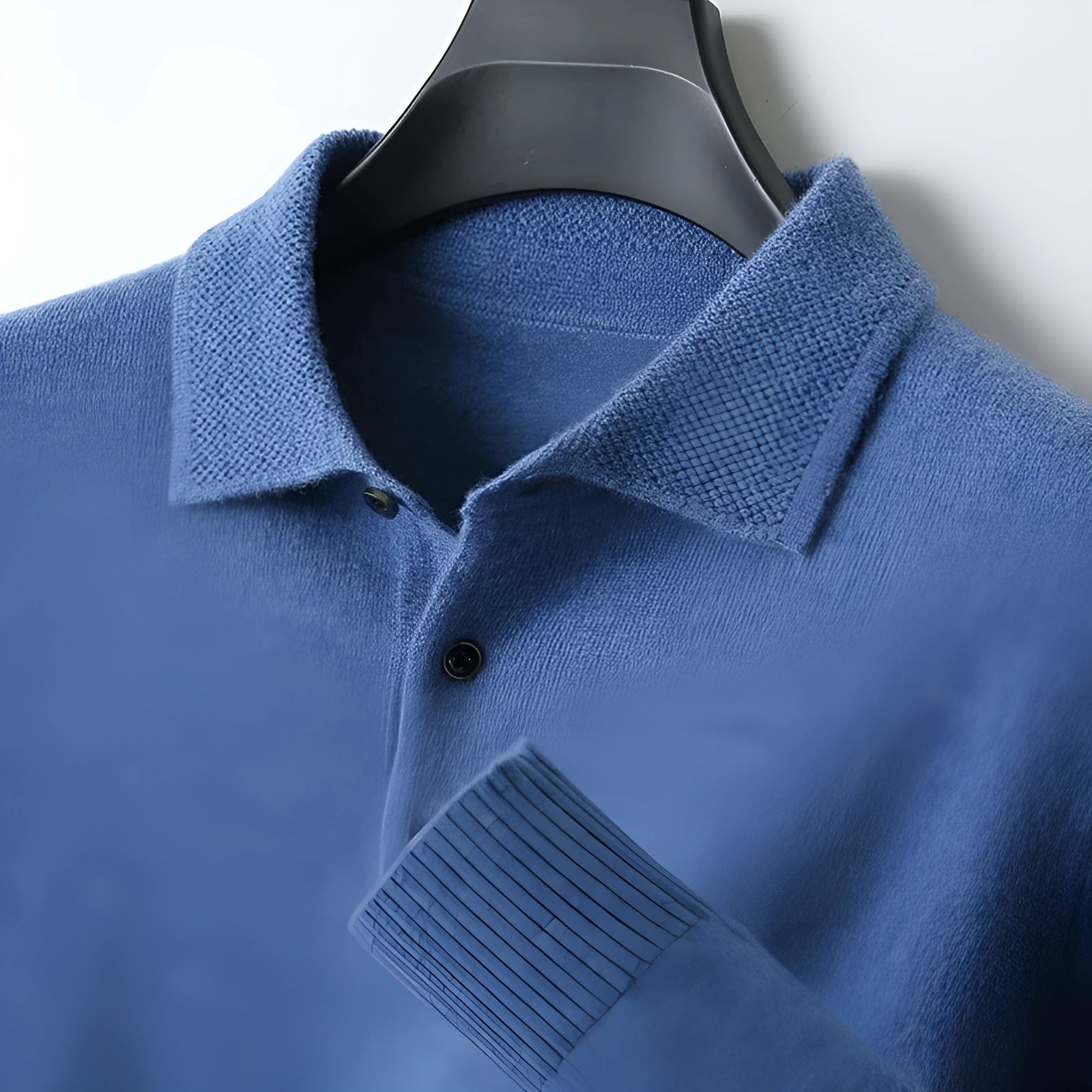 Men's grey wool pullover sweater with a polo collar and long sleeves on a hanger