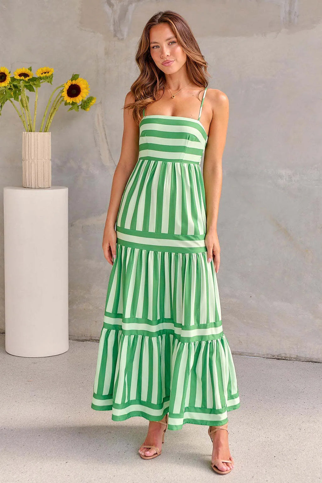 Women's striped backless summer dress with square neck, suspender straps, and pockets in polyester-spandex fabric