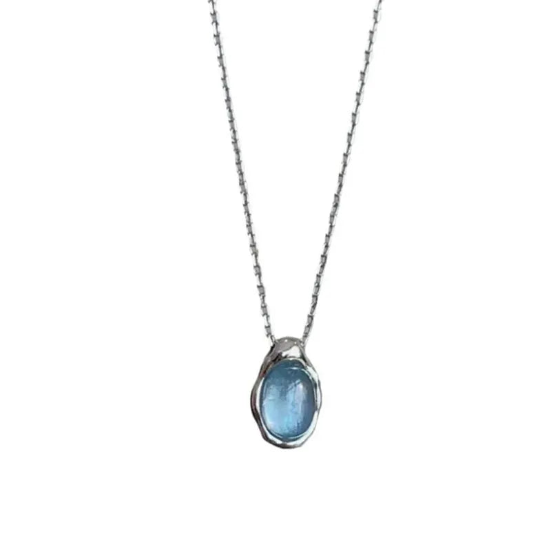 Women's navy blue geometric water drop necklace on adjustable cross chain