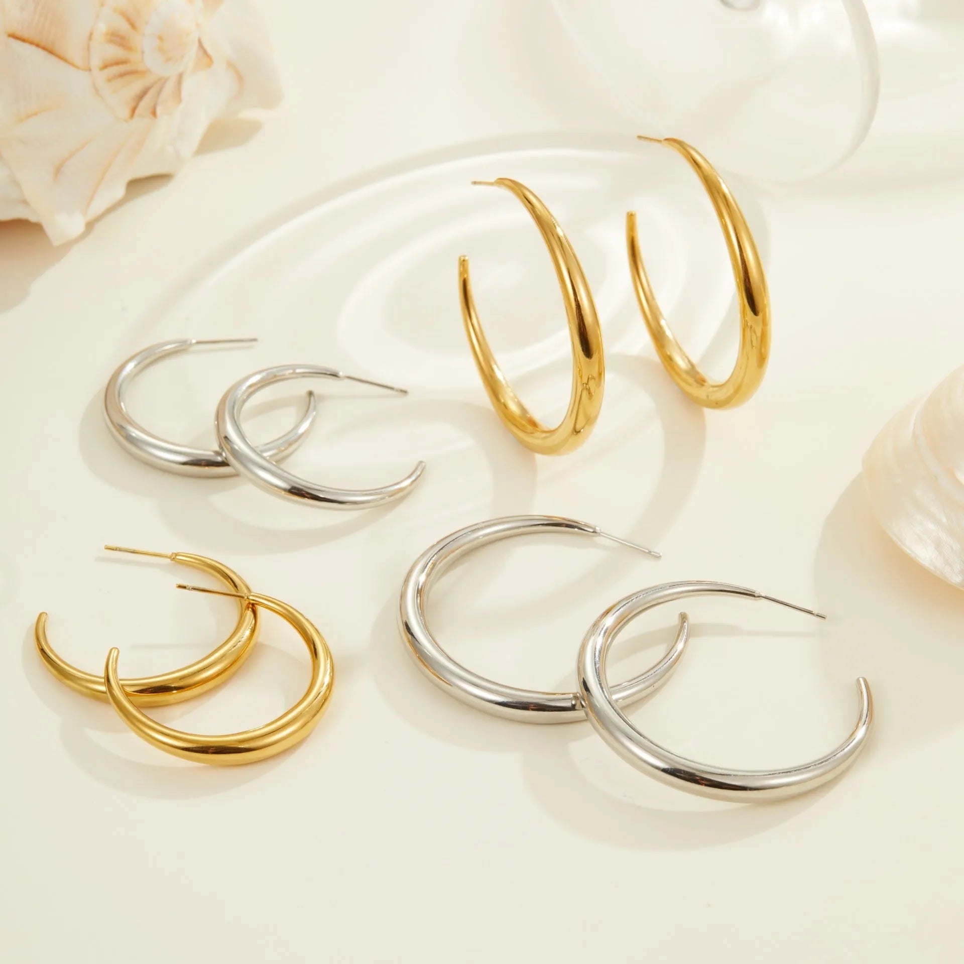 Titanium steel hoop earrings with 18K gold plating in small and large sizes