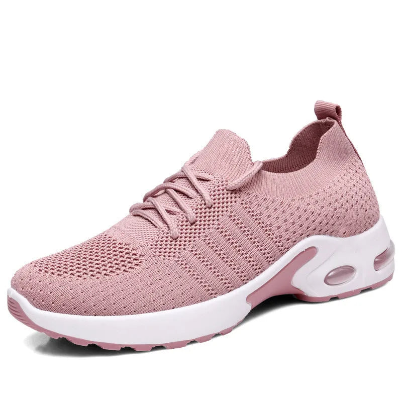 Women's black mesh casual sneaker with round toe and white non-slip PVC sole, shown from the side.