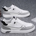 Men's low-top canvas shoes in black with leather stitching and mesh lining, shown on a white background.