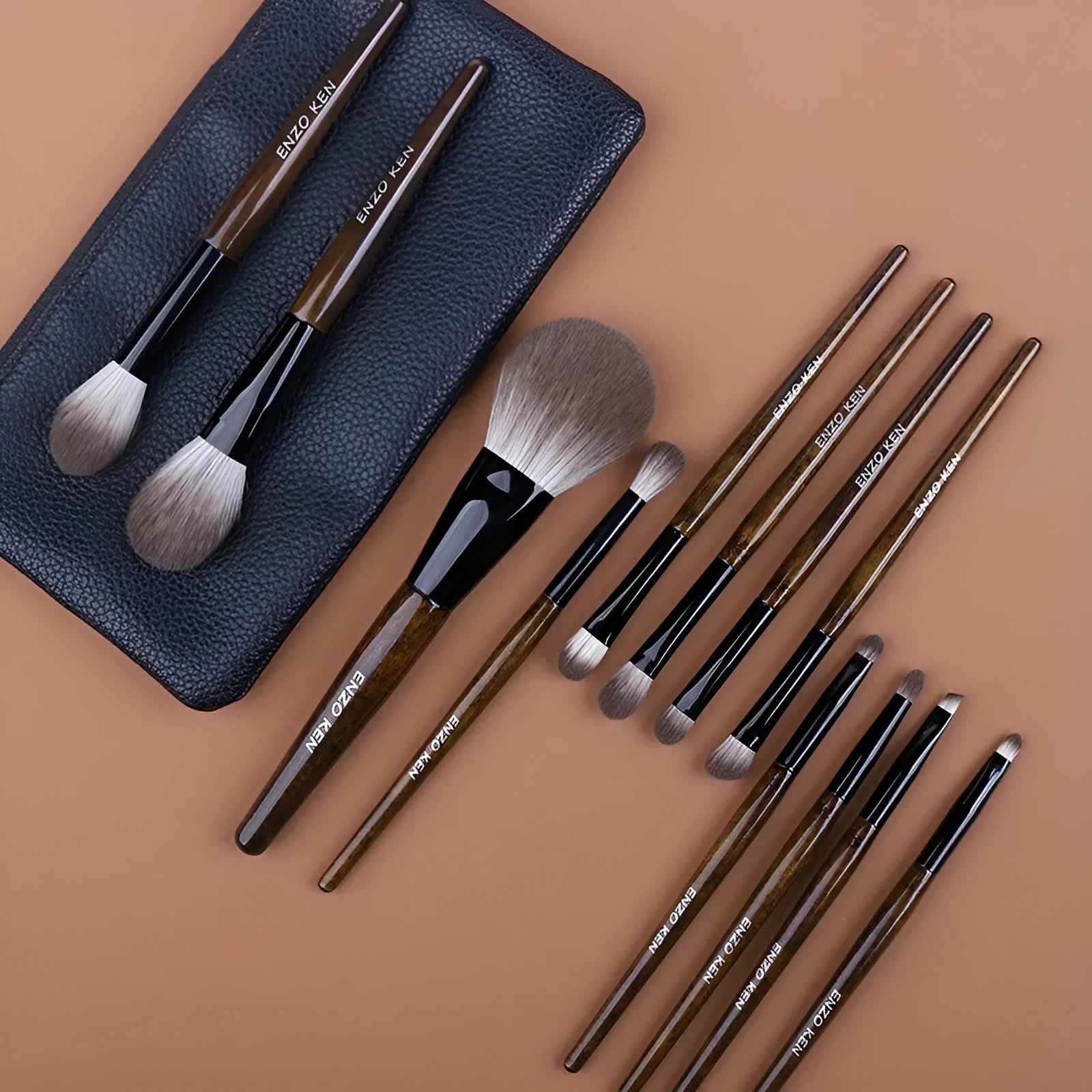 12-piece makeup brush set with wooden handles in a black PU carrying case, including a powder foundation brush.