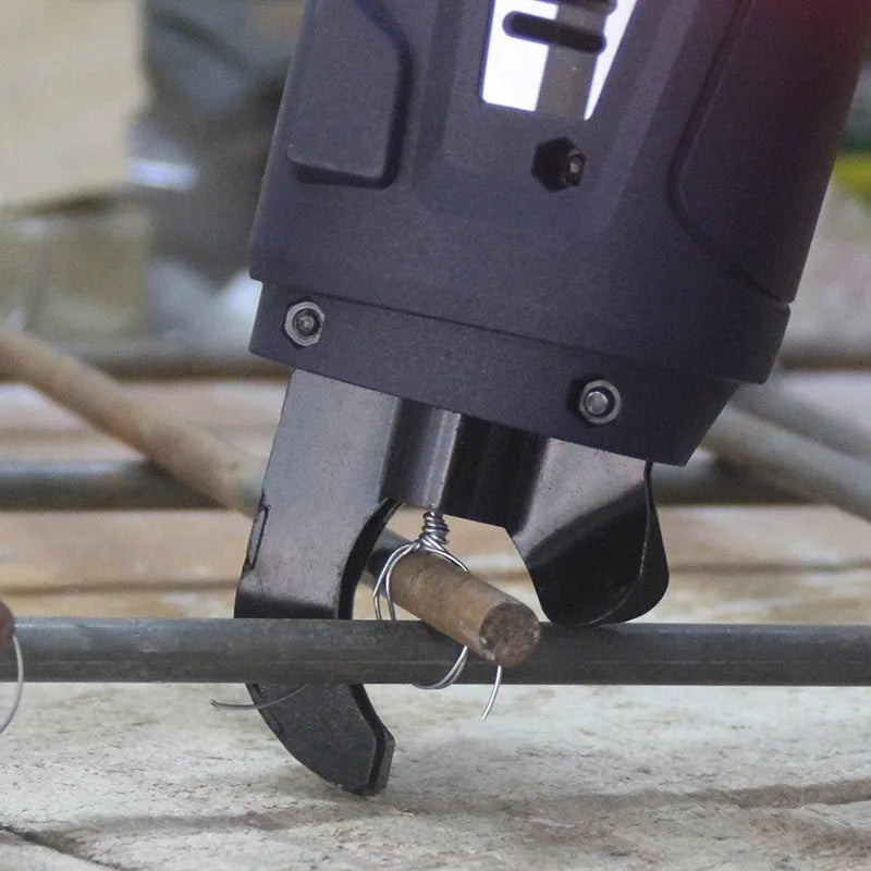 Fully automatic electric steel bar tying machine with battery on a construction site.