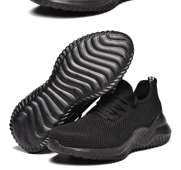 A pair of low-top work safety shoes with a steel toe cap, shown in black, grey, or dark green.