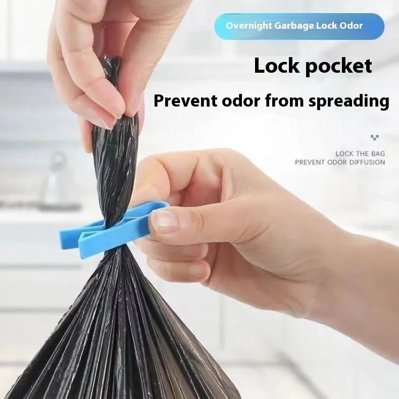 A white PP plastic clip designed to secure a bin bag to the side of a kitchen rubbish bin.