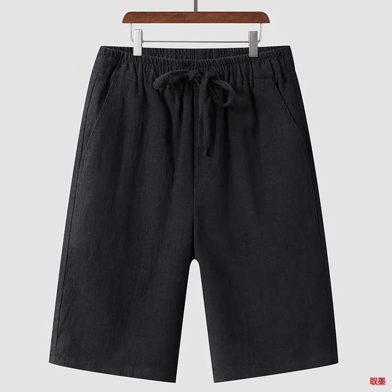 Man wearing beige linen cropped shorts with a loose fit and elasticated waist