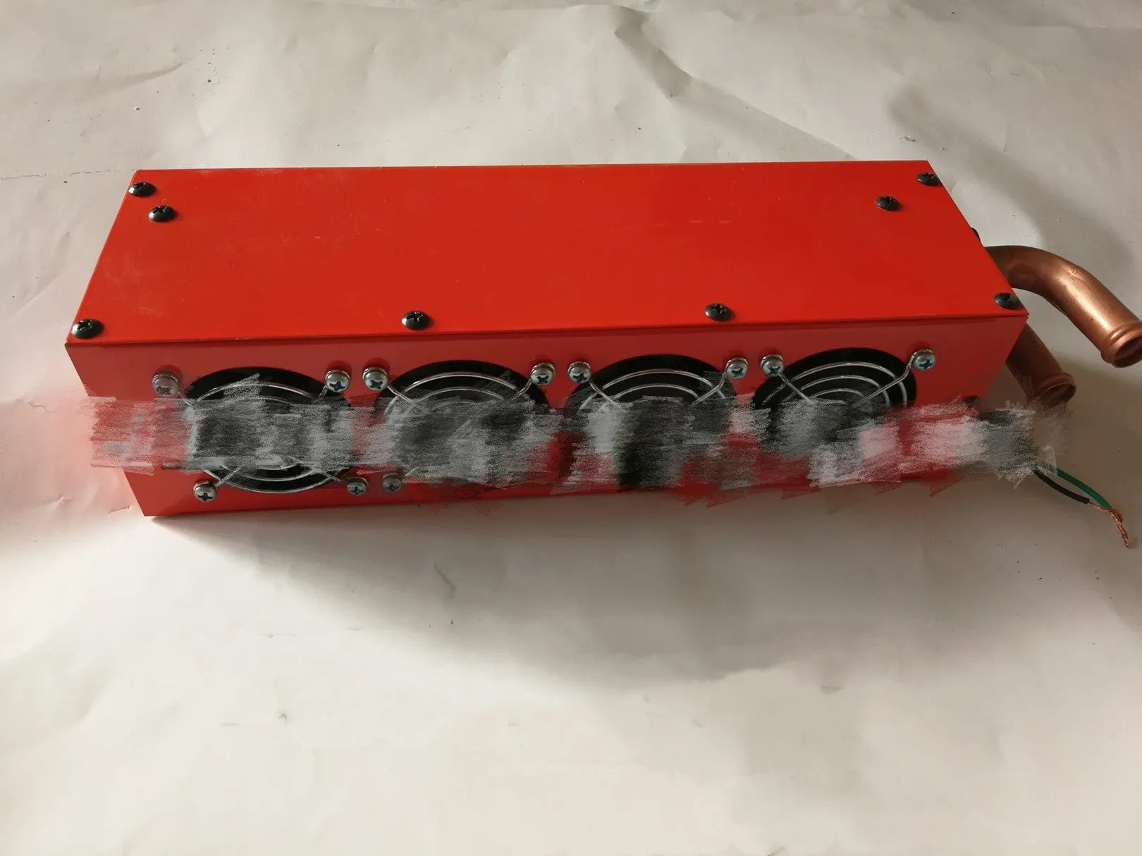 Metal car heater with copper pipe connections for 12V and 24V vehicle systems.