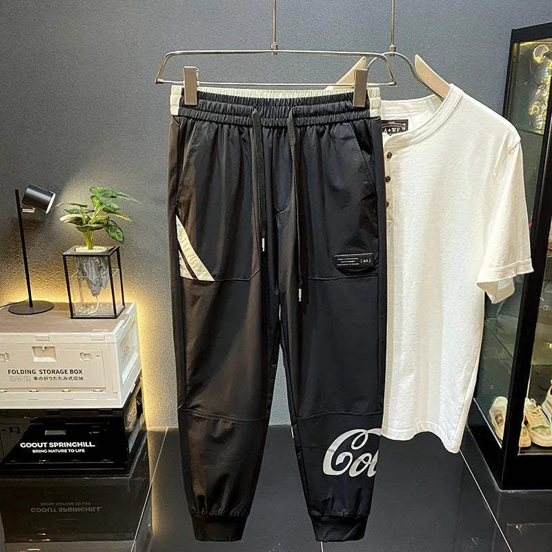 Black men's cropped trousers with elasticated ankle band in ultra-thin ice silk fabric