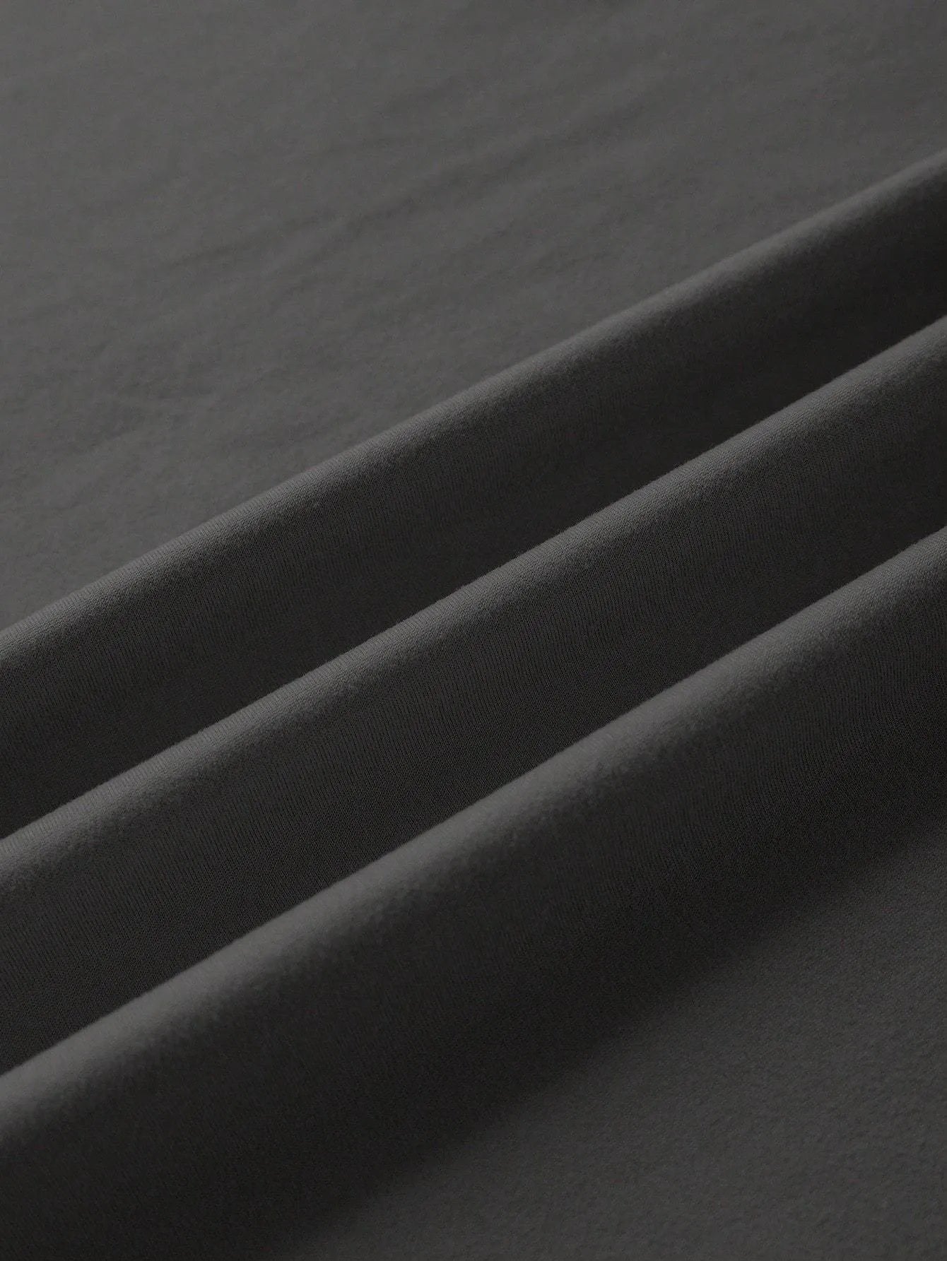 A straight-cut cotton T-shirt with short sleeves and a round neck, shown in one of the available colours.