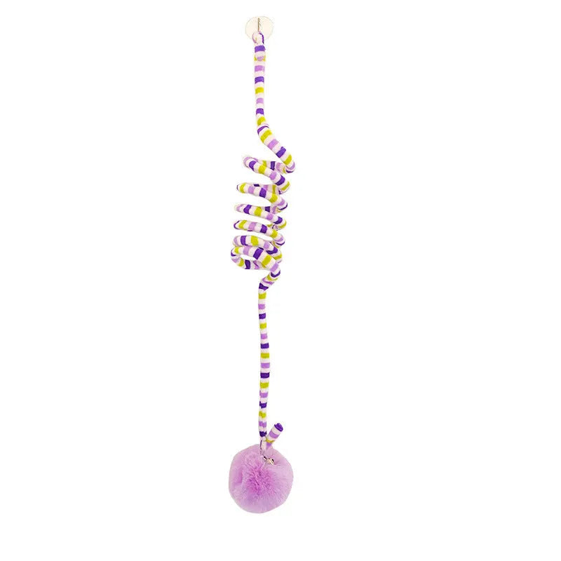 Colourful cat toy with spring bell stick and inflatable ball attached to a door by a suction cup