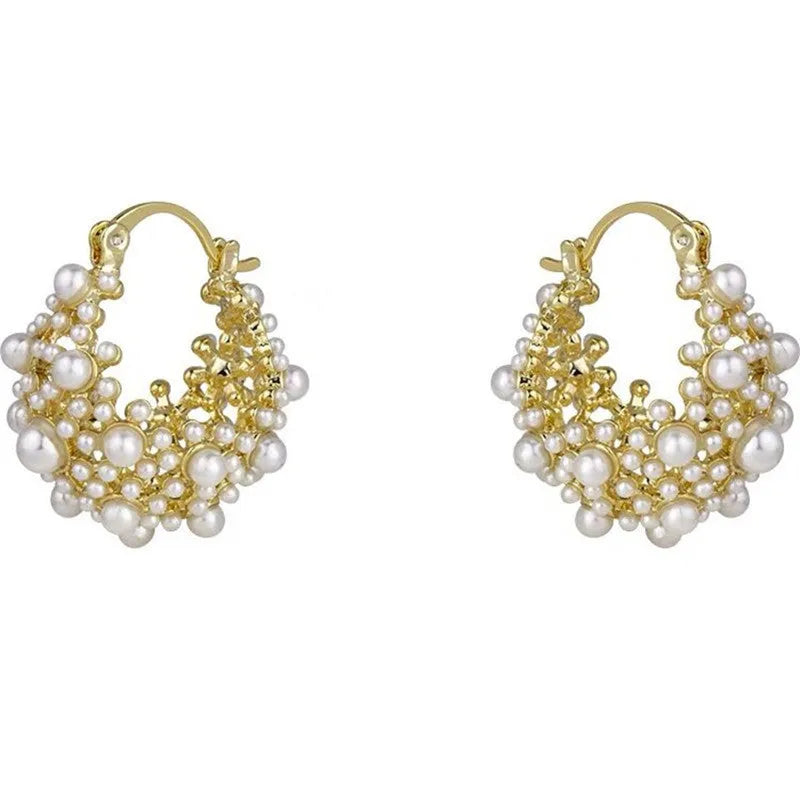 Gold-coloured copper earrings with a small bead flower basket design.