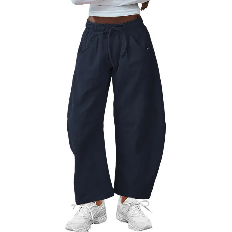 Loose cropped cotton sweatpants with elastic drawstring waist and side pockets in multiple colour options