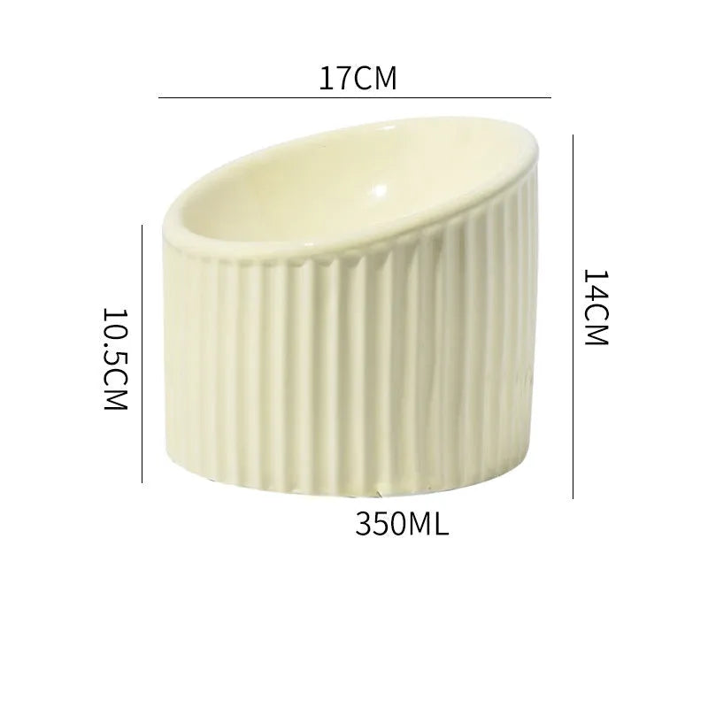 Elevated ceramic cat bowl in green colour with tilted design for whisker-friendly feeding