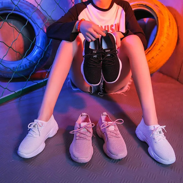 Women's white thick-soled casual sports shoes with woven upper and front strap.