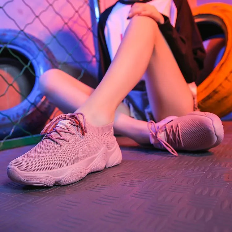 Women's white thick-soled casual sports shoes with woven upper and front strap.