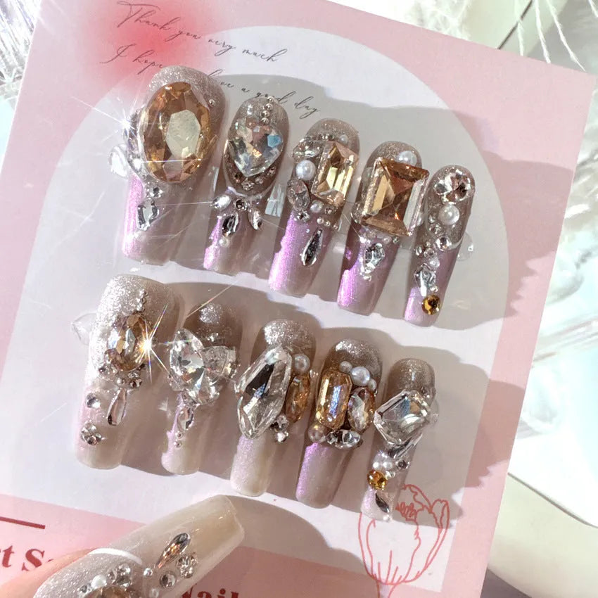 Rhinestone-decorated false nail patches on card packaging with application adhesive and tools