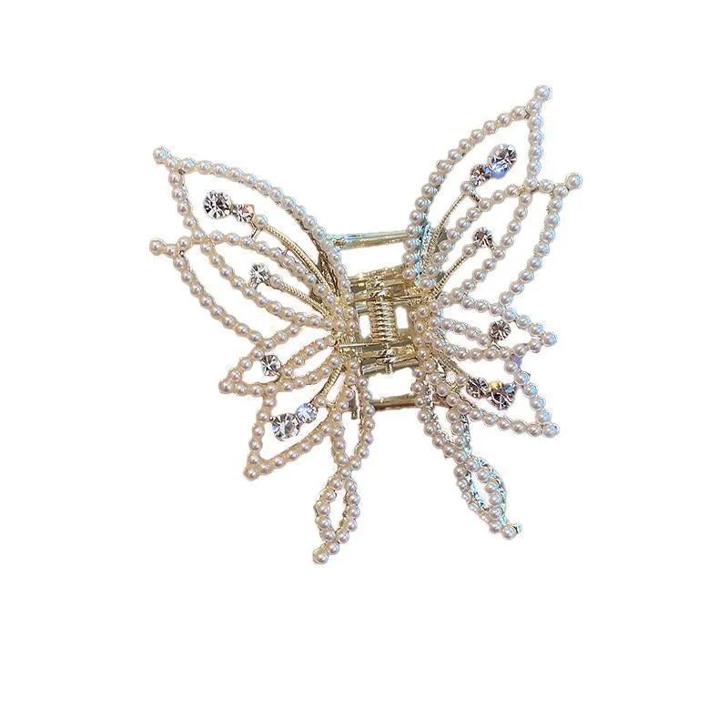 Butterfly-shaped alloy hair clip barrette for women, shown in rhinestone and pearl style options.
