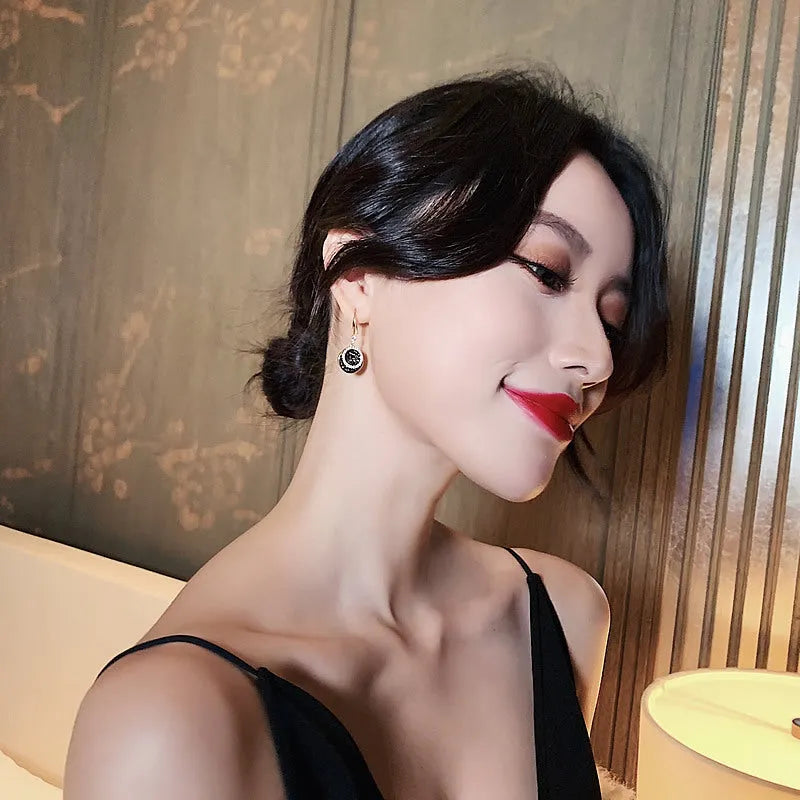 Black geometric drop earrings with circular design and 3.6cm length in retro Hong Kong style
