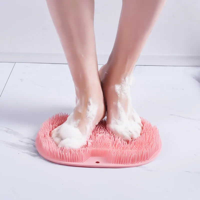Orange silicone bristle bath brush with suction cups on base, size 23x30cm, for foot and back cleaning.
