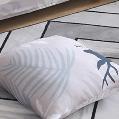 Printed stretch sofa cover with geometric pattern on three-seater sofa