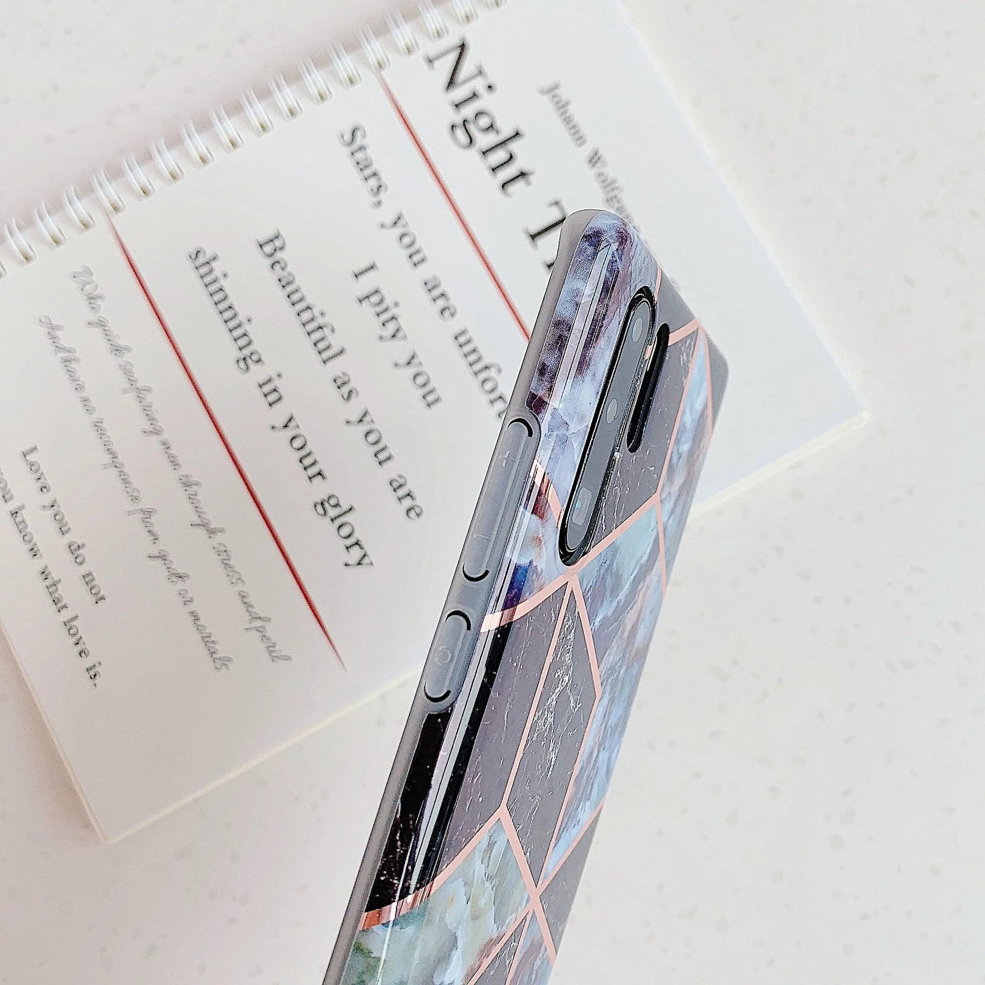 Glossy electroplated marble design TPU back cover case for a Huawei smartphone.