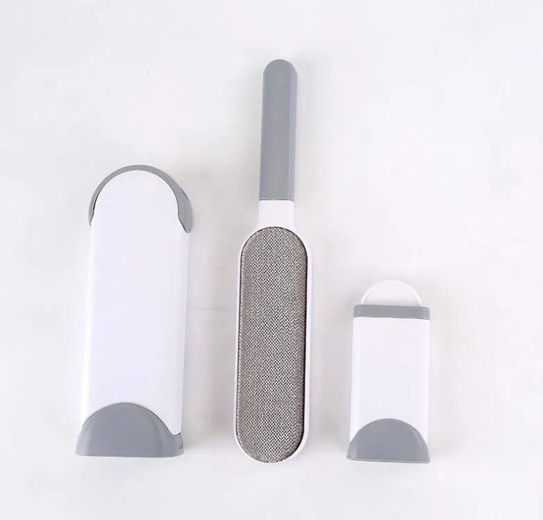 Blue reusable pet hair removal comb with double-sided brush and self-cleaning base for furniture.