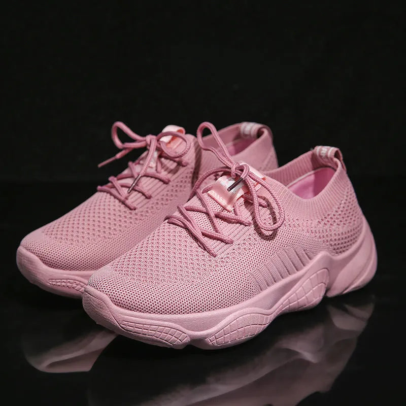 Women's white thick-soled casual sports shoes with woven upper and front strap.