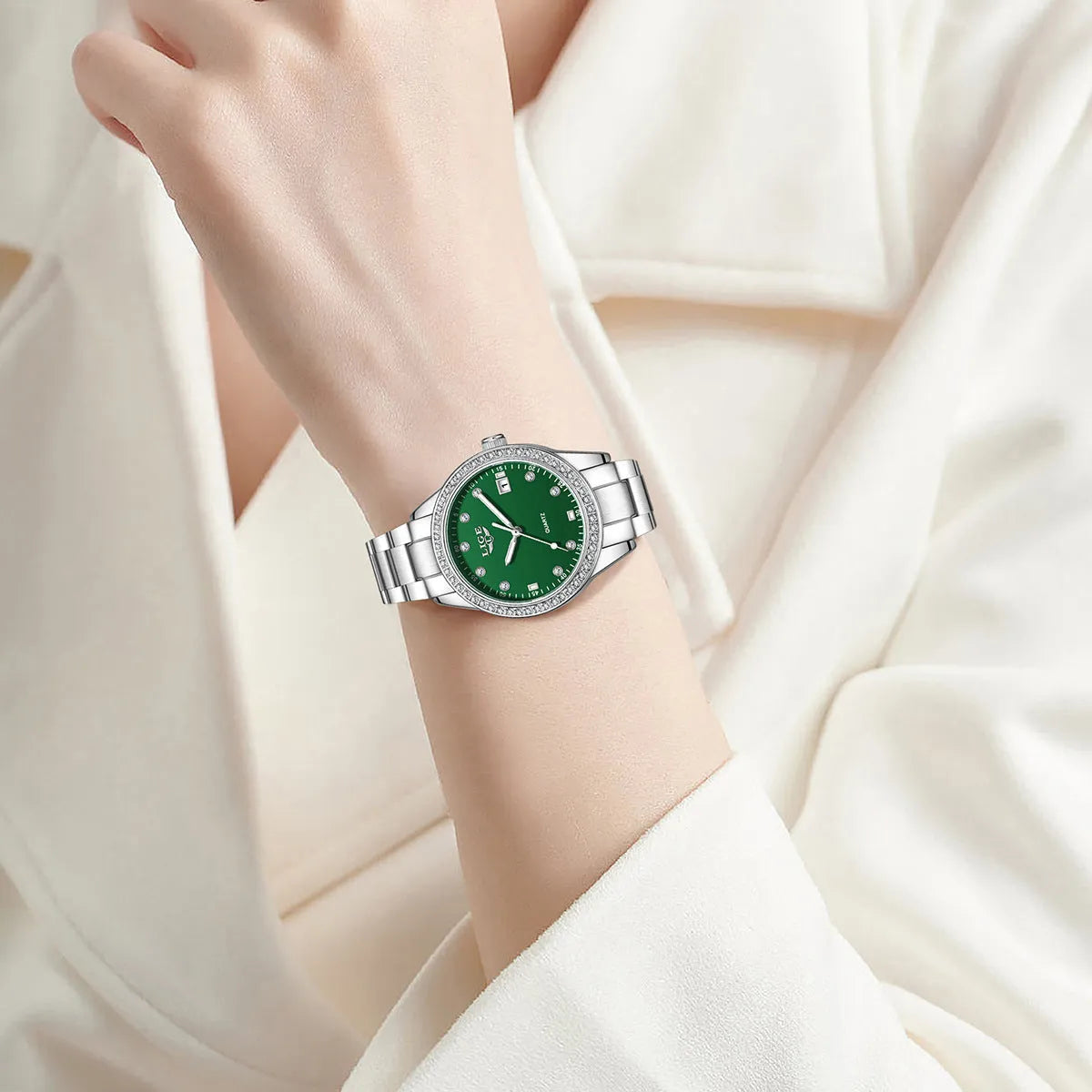 Silver stainless steel women's quartz watch with diamond markers and round dial