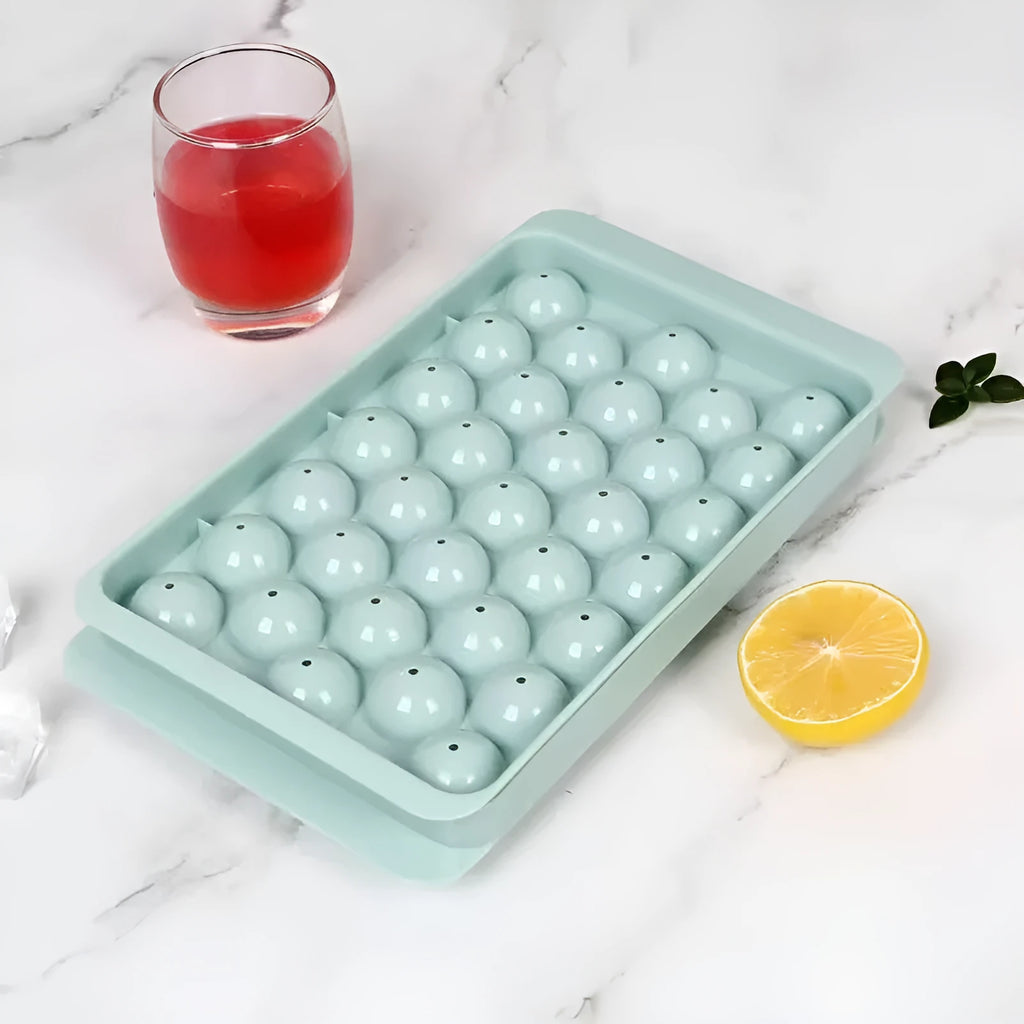 Blue silicone ice cube tray with lid showing 33 round moulds