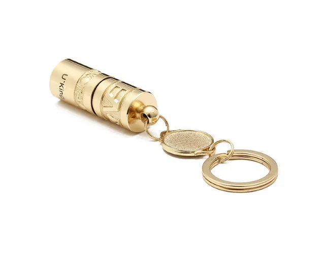 Gold zinc alloy waterproof LED flashlight attached to keychain with compact portable design