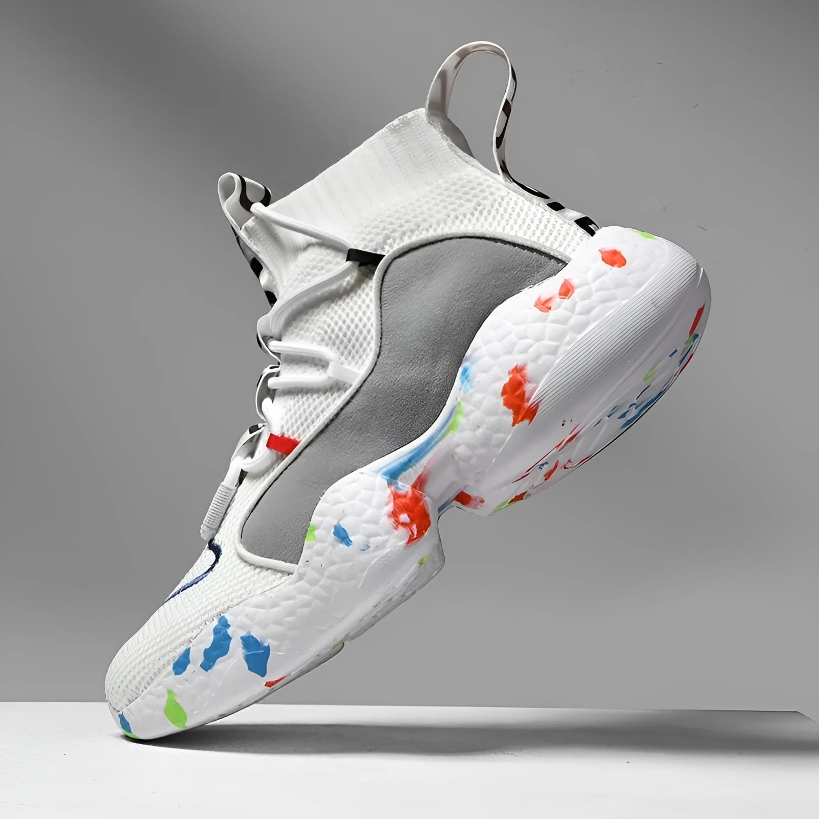 Men's camouflage pattern sneakers with mesh upper and flat vulcanised rubber sole.