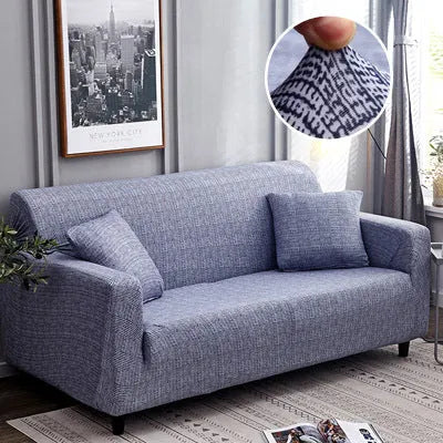 Printed stretch sofa cover with geometric pattern on three-seater sofa