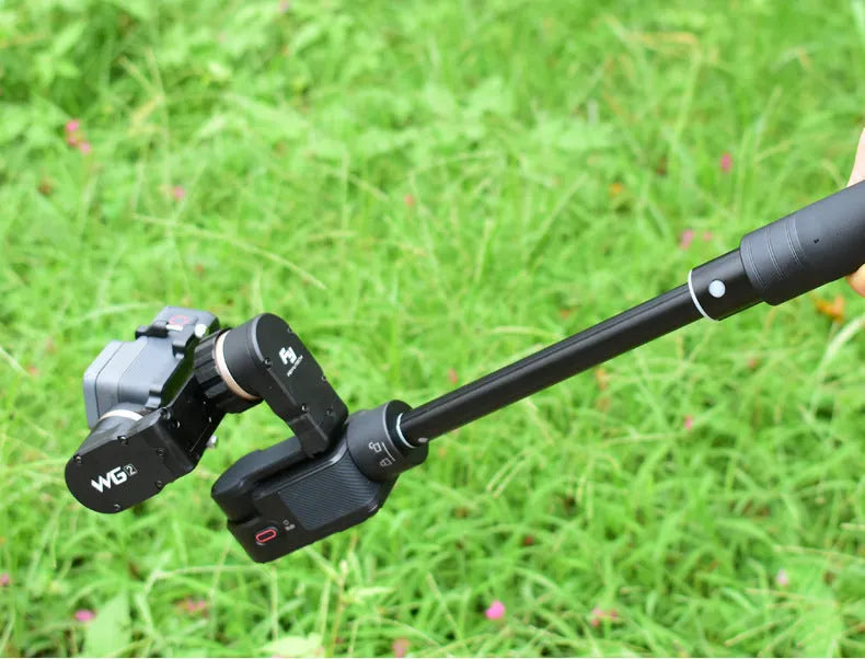 Black retractable selfie stick with adjustable phone mount extended to full length