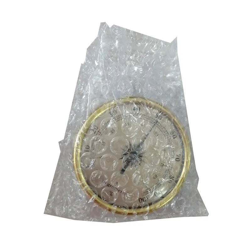 Circular aluminium analogue thermometer and hygrometer showing temperature and humidity dials
