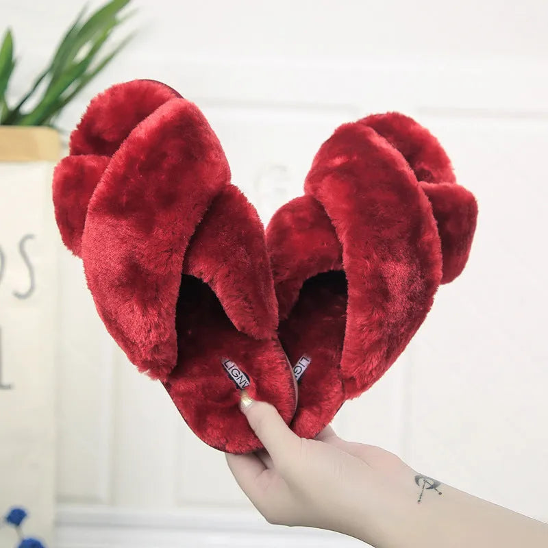 Cross strap open-toe fur slippers in multiple colours on a non-slip rubber sole.