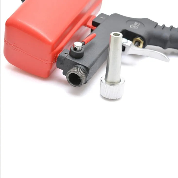 Portable black pneumatic sandblasting gun with tank and nozzle for rust removal.