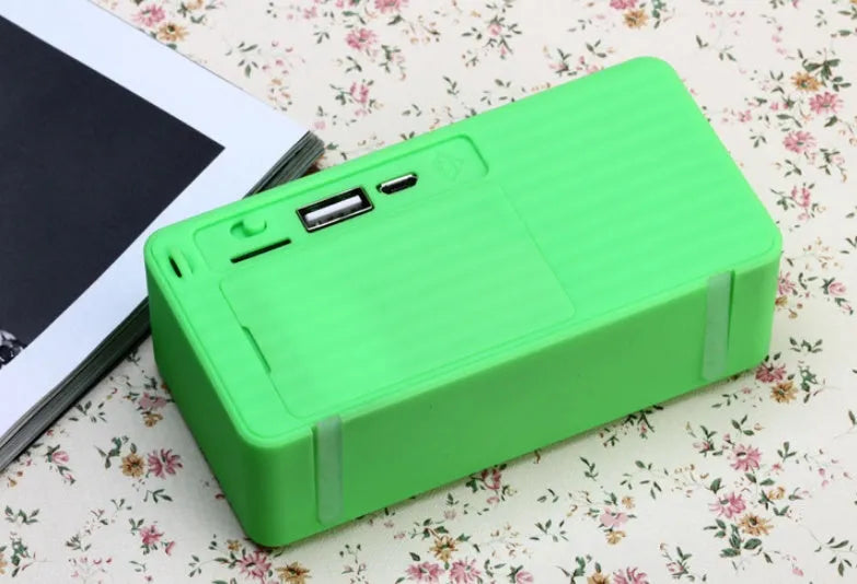 Cannon X3 small portable Bluetooth speaker in black, blue, green, red, or yellow colour with cube subwoofer design