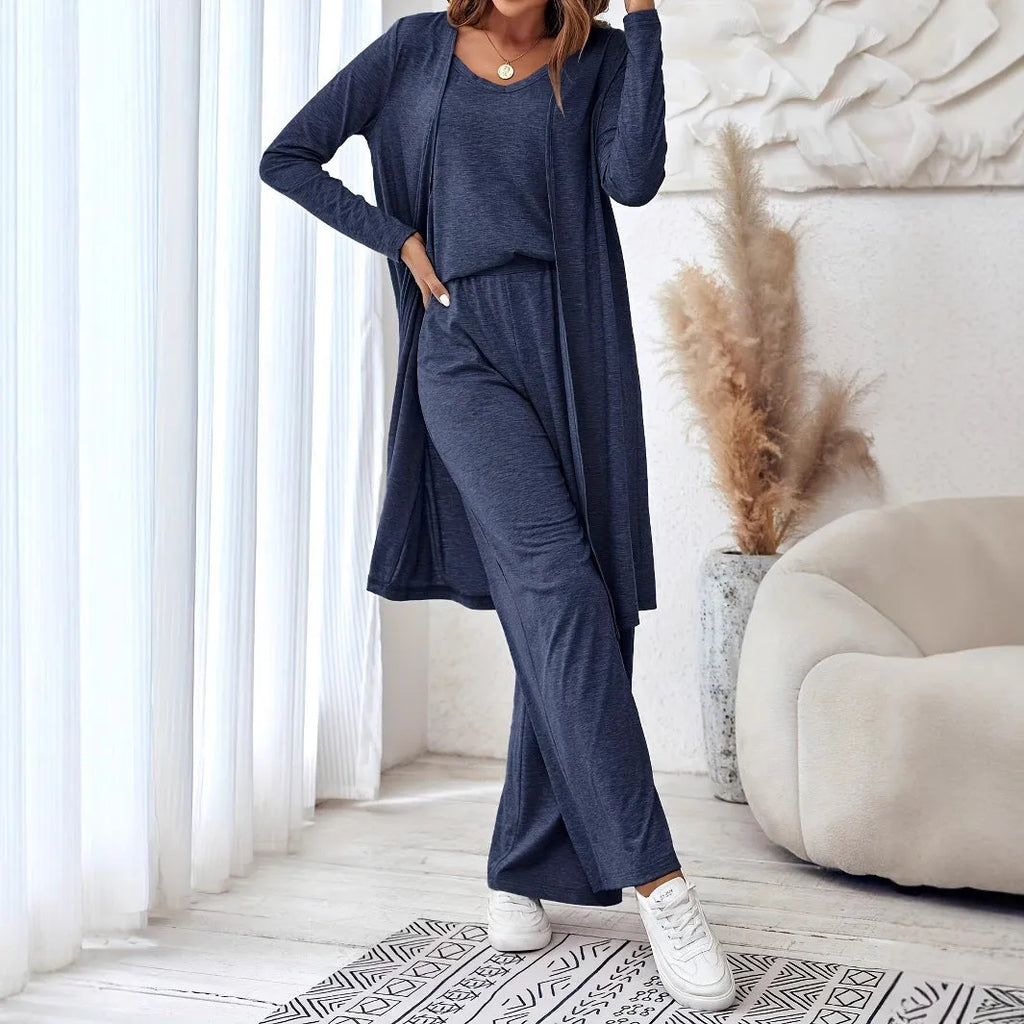 Blue women's three-piece casual suit set featuring trousers, a long-sleeve top, and suspenders on a hanger.