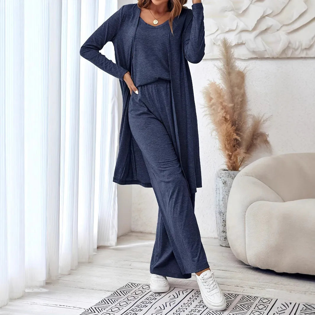 Blue women's three-piece casual suit set featuring trousers, a long-sleeve top, and suspenders on a hanger.