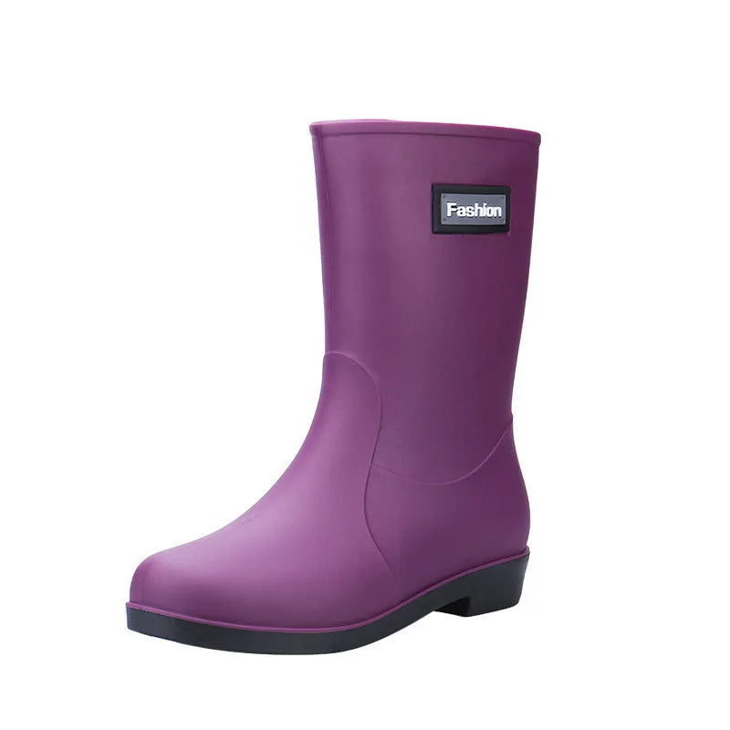 Women's black PVC rain boots with mid-calf height and low heel