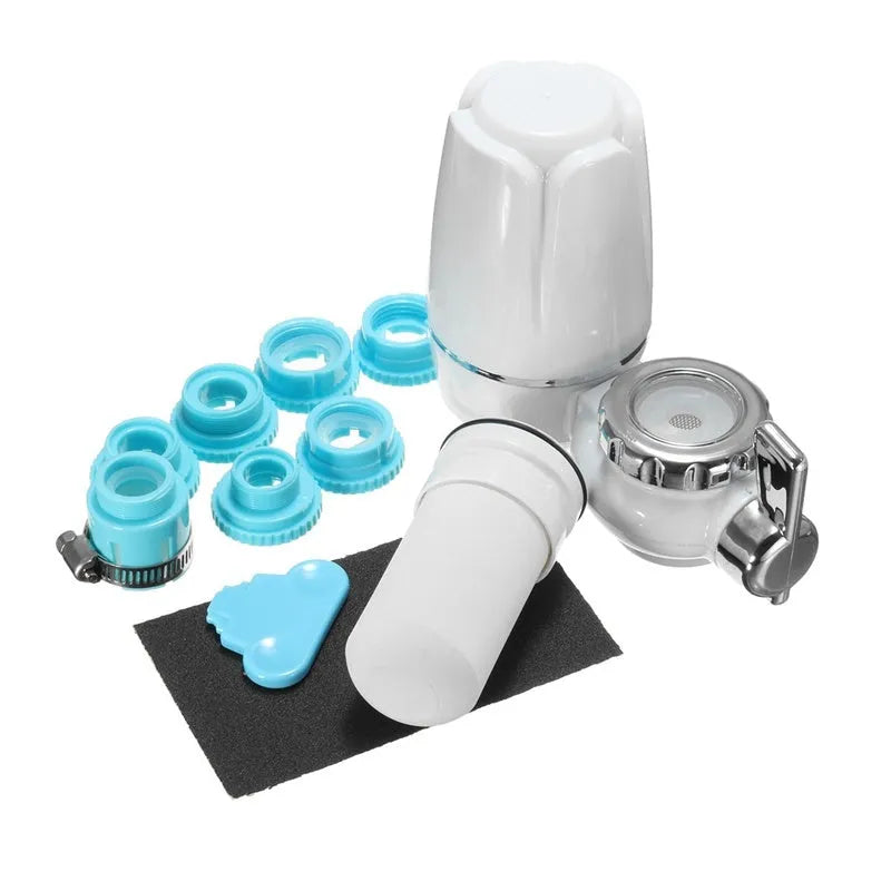 White plastic faucet-mounted water filter with ceramic cartridge and tap adapters