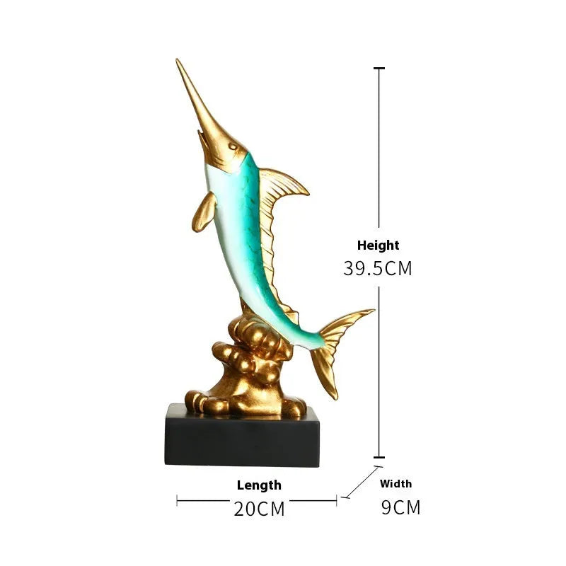 Close-up of a detailed resin European swordfish ornament in bright gold colour on a shelf.