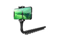 Flexible rubber phone holder with suction cup mounted on desktop showing 360-degree rotation