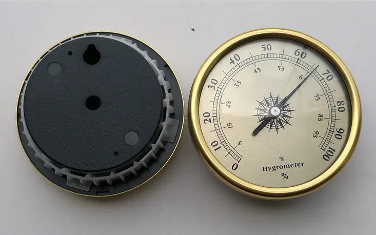 Circular aluminium analogue thermometer and hygrometer showing temperature and humidity dials