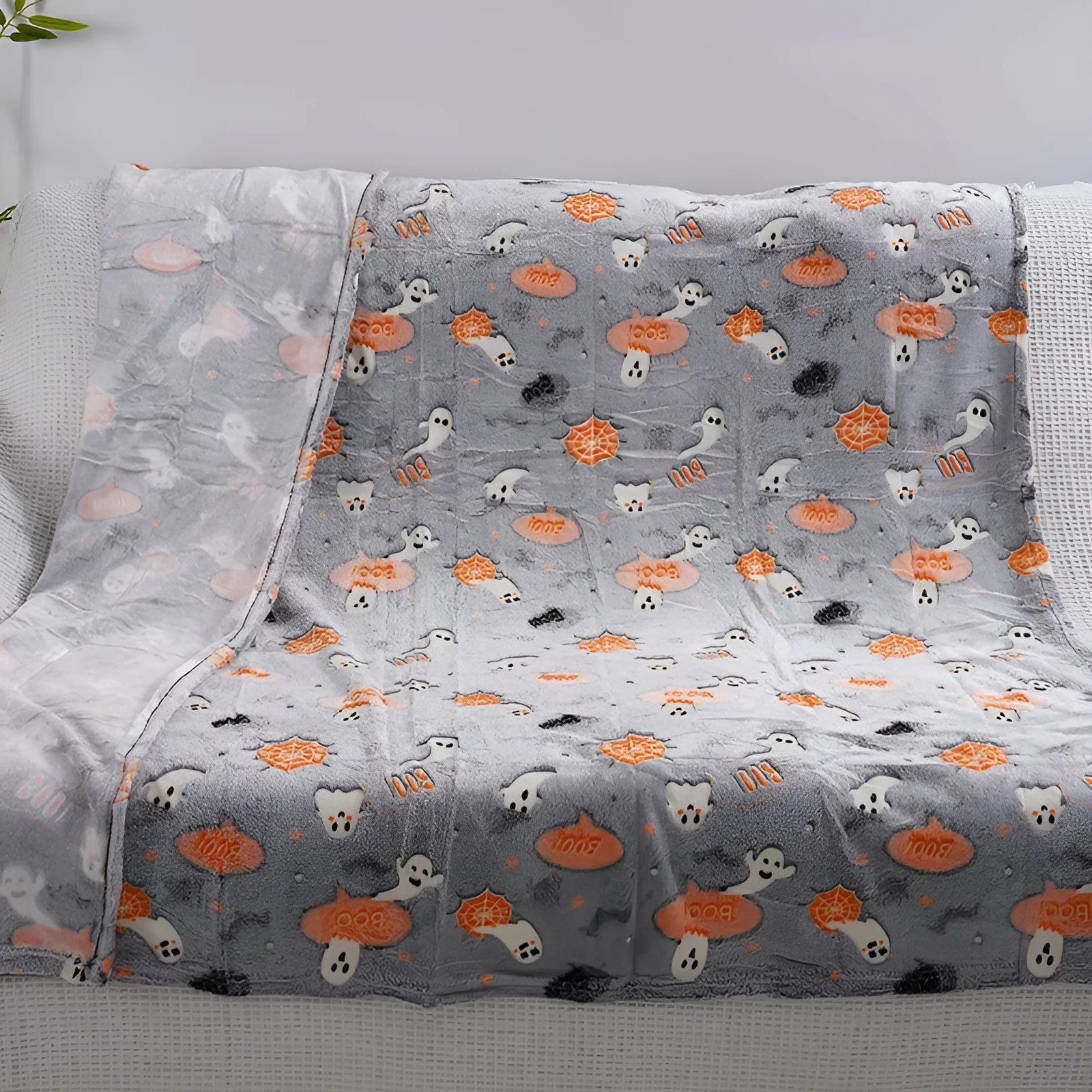 Cartoon print flannel blanket for children shown in two sizes.