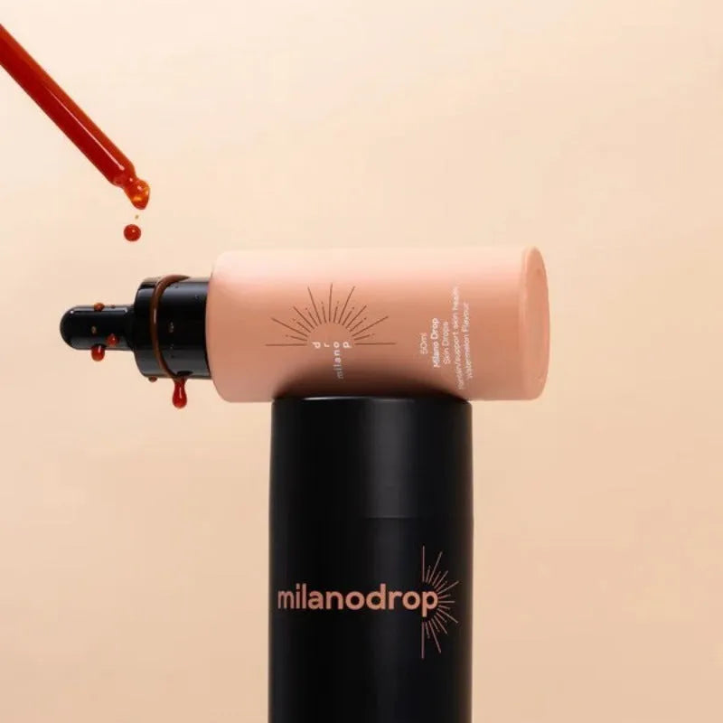 Matte sun tanning black liquid set showing 50ml tanning drops bottle and 75ml tanning flash cream tube.