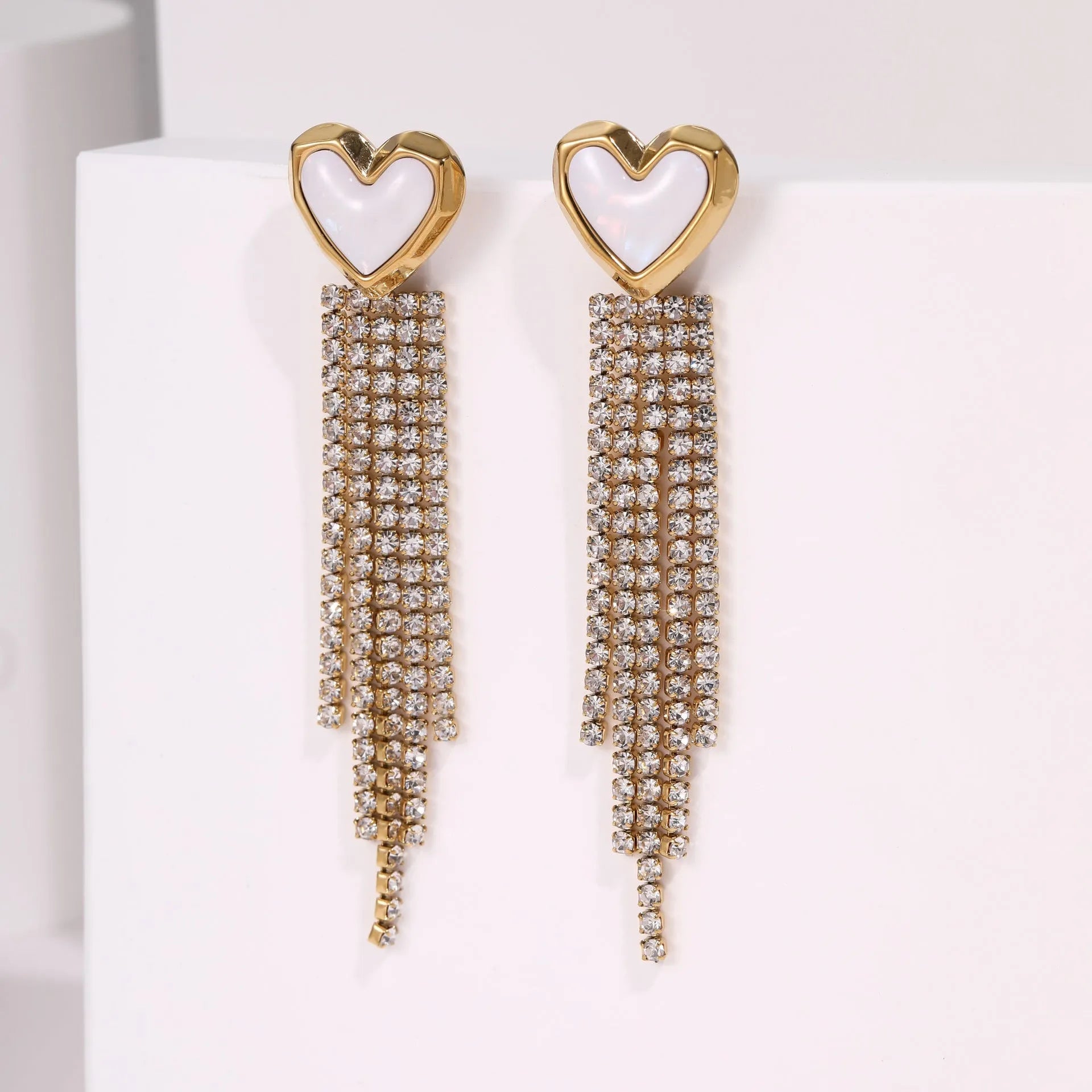 Gold plated stainless steel earrings with love heart and star geometric shapes and diamond tassel details