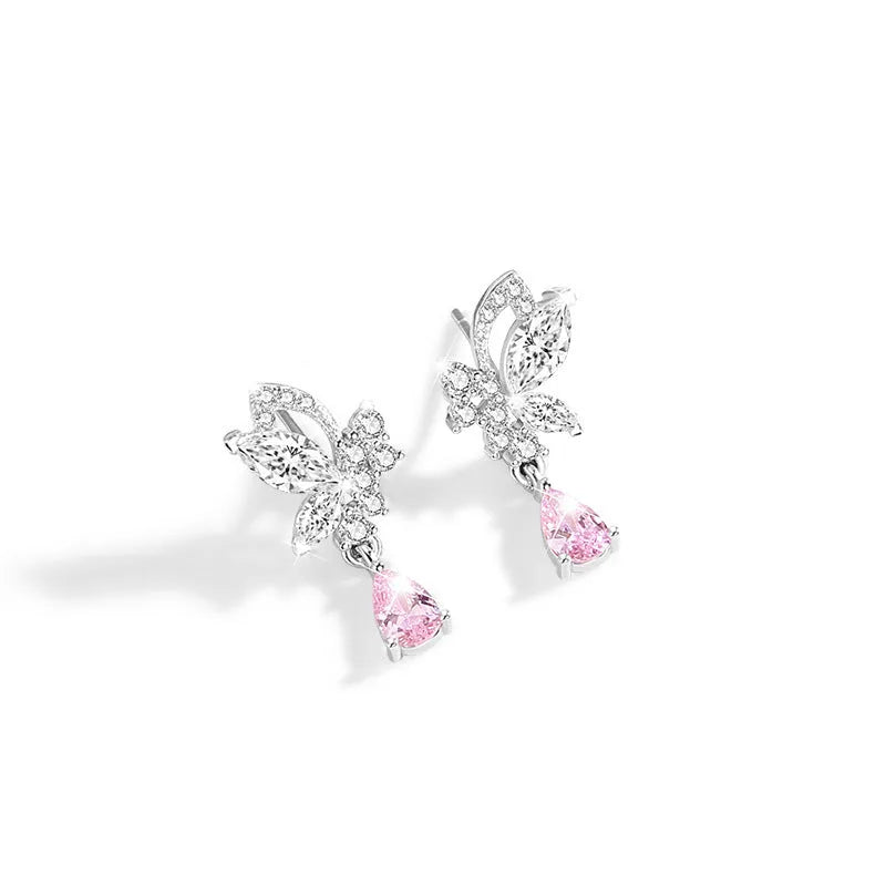 A pair of sterling silver butterfly stud earrings with crystal details on a white background.